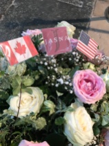Flowers next to the grave site. Notice JASNA representing.